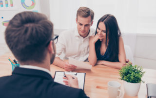 Young couple reviewing a document